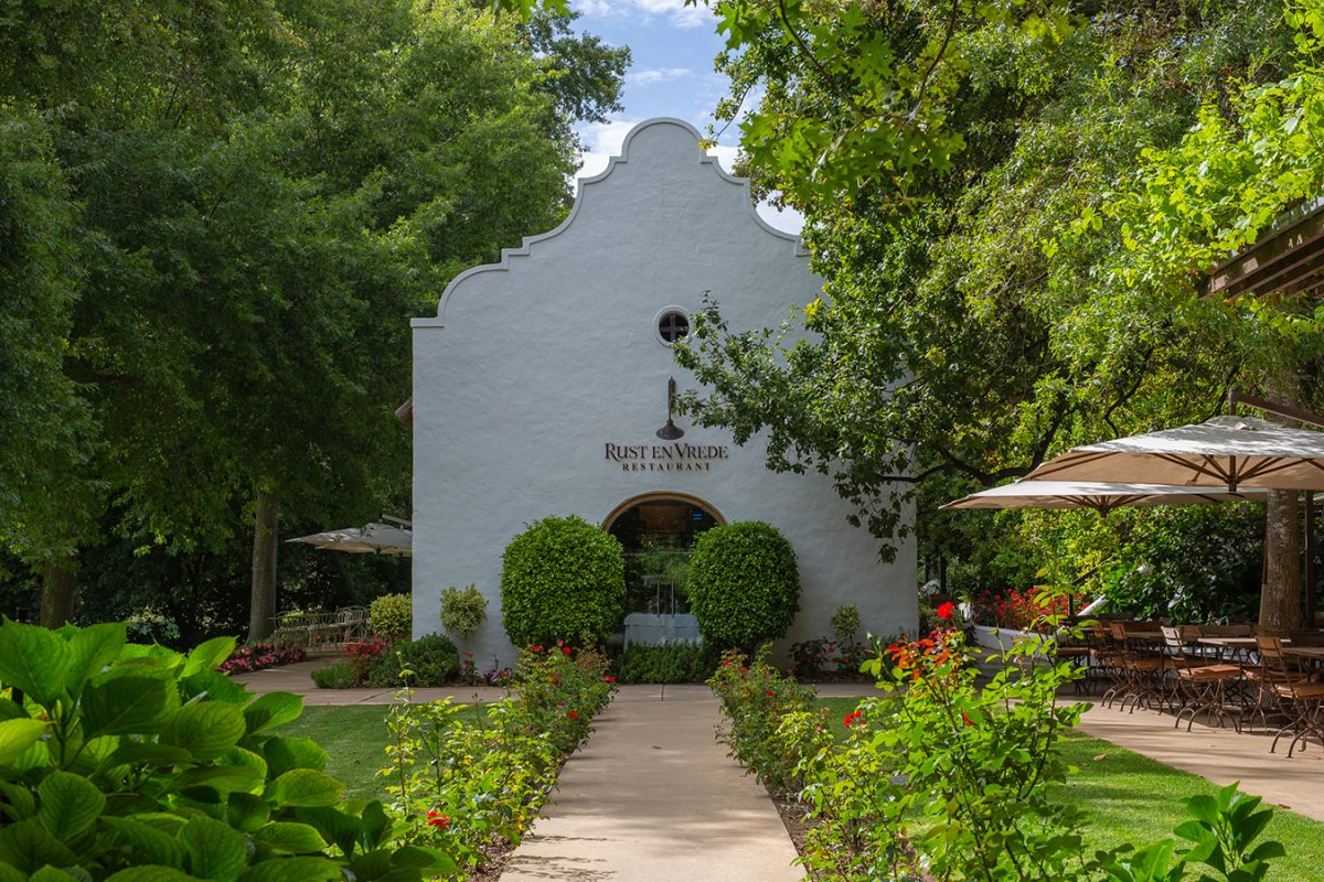 Image of outdoor garden, terrace and entrance into Rust en Vrede Wine Estate hotel