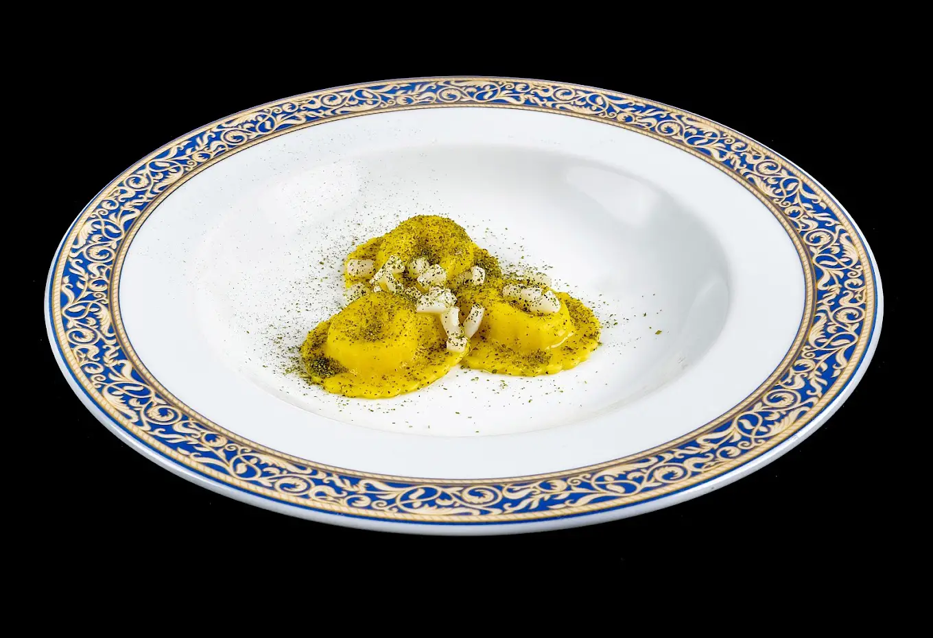 Image of a ravioli with olive oil and parmigiano at L'Imbuto restaurant