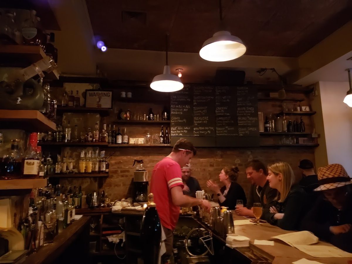 People socializing inside the Bondurants bar