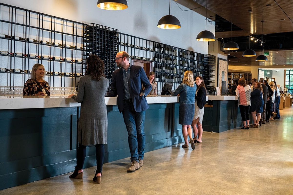 Interior of a Chateau Ste. Michelle Winery wine shop with people wiating to buy wine