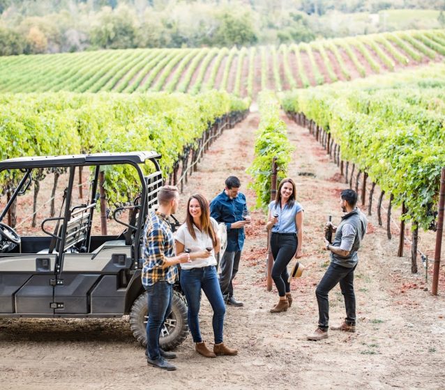 A group of friends at the vineyard of Hess Persson Estates
